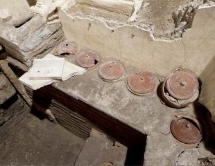 Necropolis of the “ Via Triumphalis”, S. Rosa sector, cinerary urns with lids, inside tomb no. XXXII